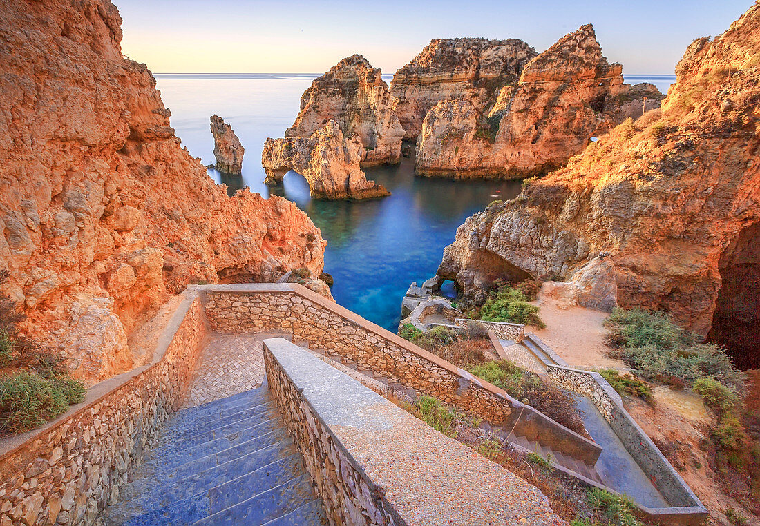 Soft colors of dawn on the red cliffs of Ponta Da Piedade, Lagos, Algarve, Portugal, Europe