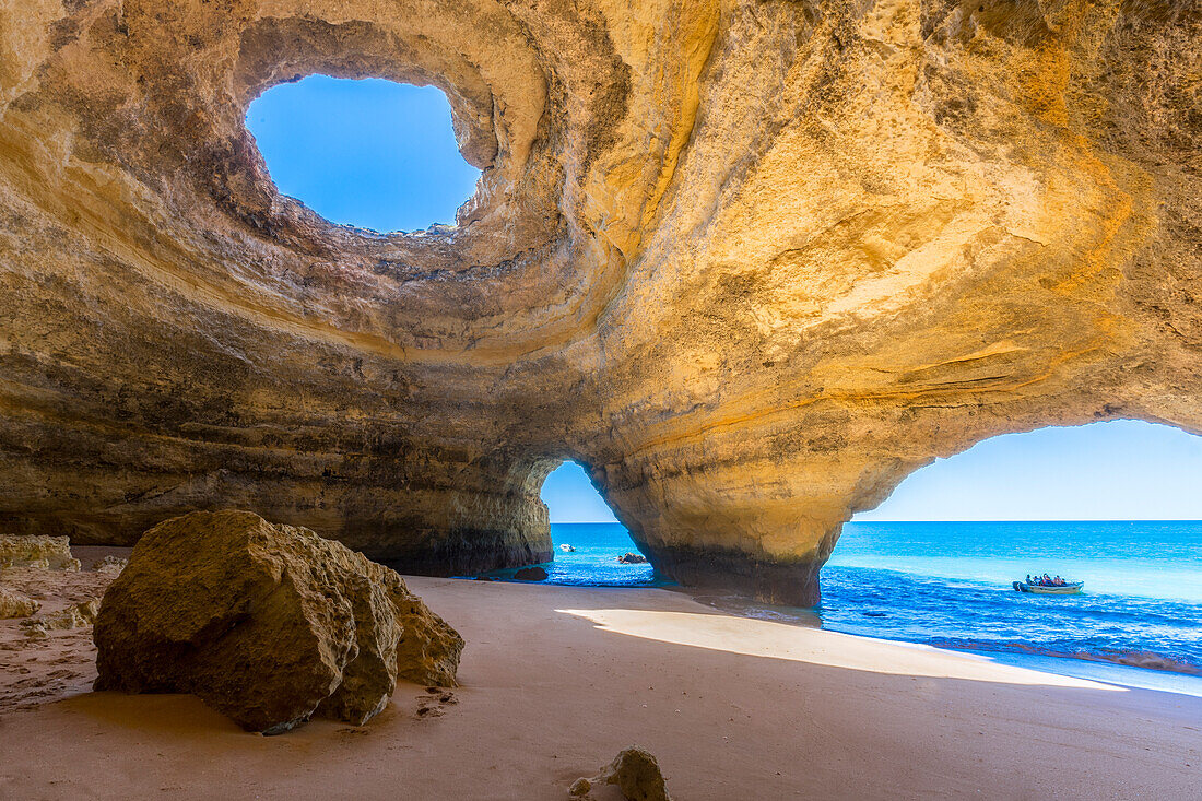The sea caves of Benagil with natural windows on the clear waters of the Atlantic Ocean, Faro District, Algarve, Portugal, Europe