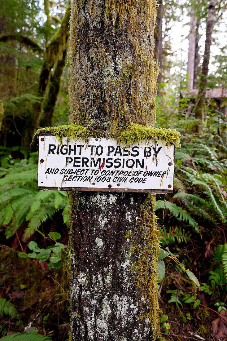 Permission sign for fishing along the McKenzie River posted on a property with a private owner.