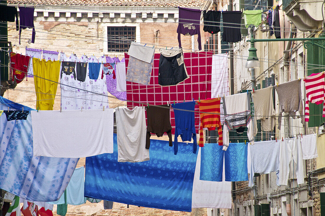 hanging lines of drying washing, across the street, Castello quarter, Venice, Italy.