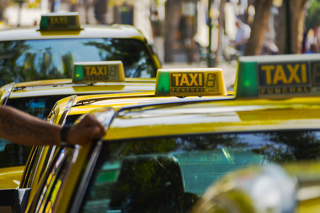 Taxi drivers on the streets of Funchal, Madeira Island, Portugal.