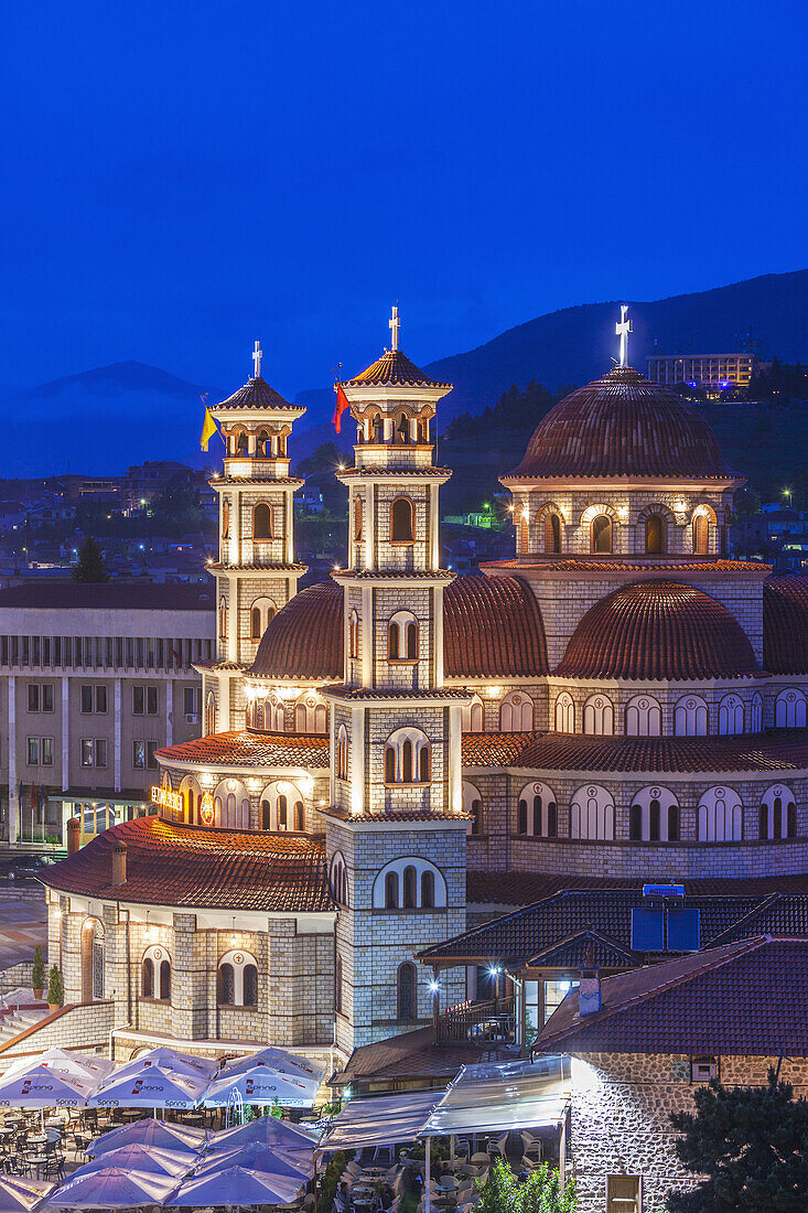 Albania, Korca, the Orthodox Cathedral, elevated view along the Boulevard Republika, dusk.