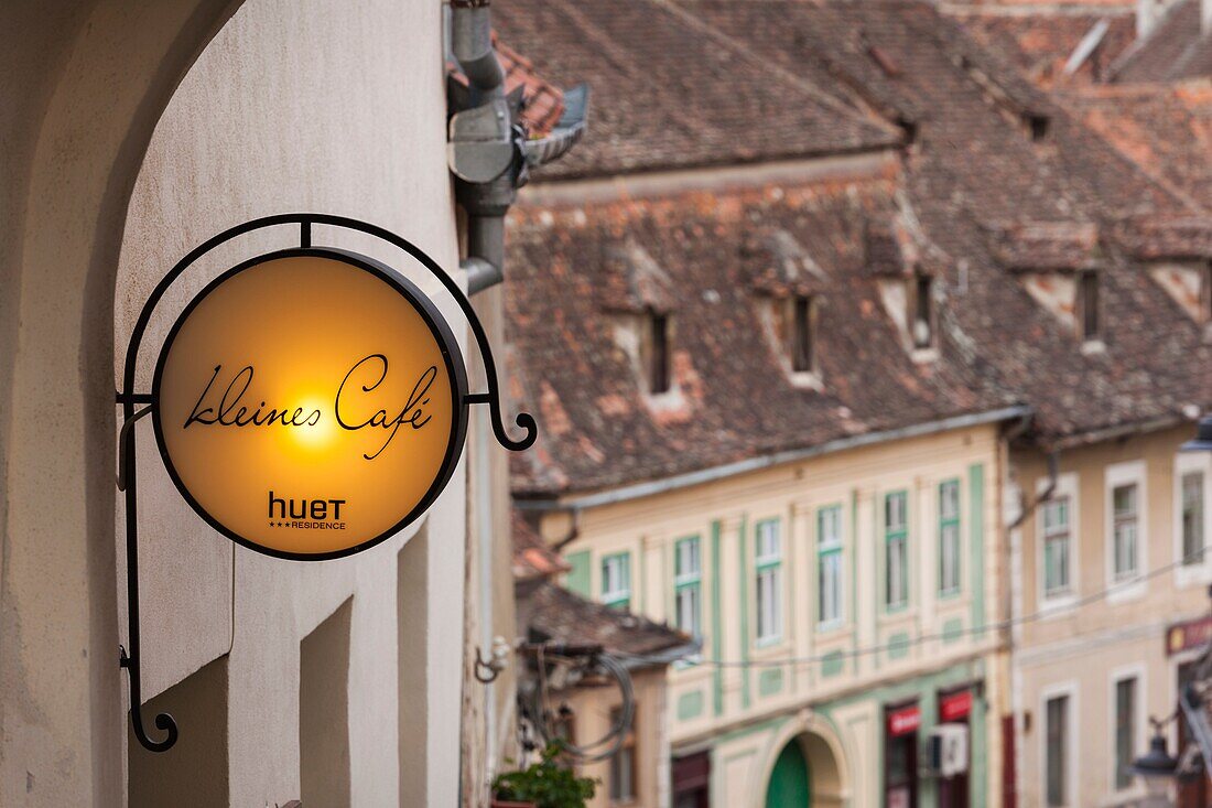 Romania, Transylvania, Sibiu, Piata Huet Square, sign for the Kleines Cafe.