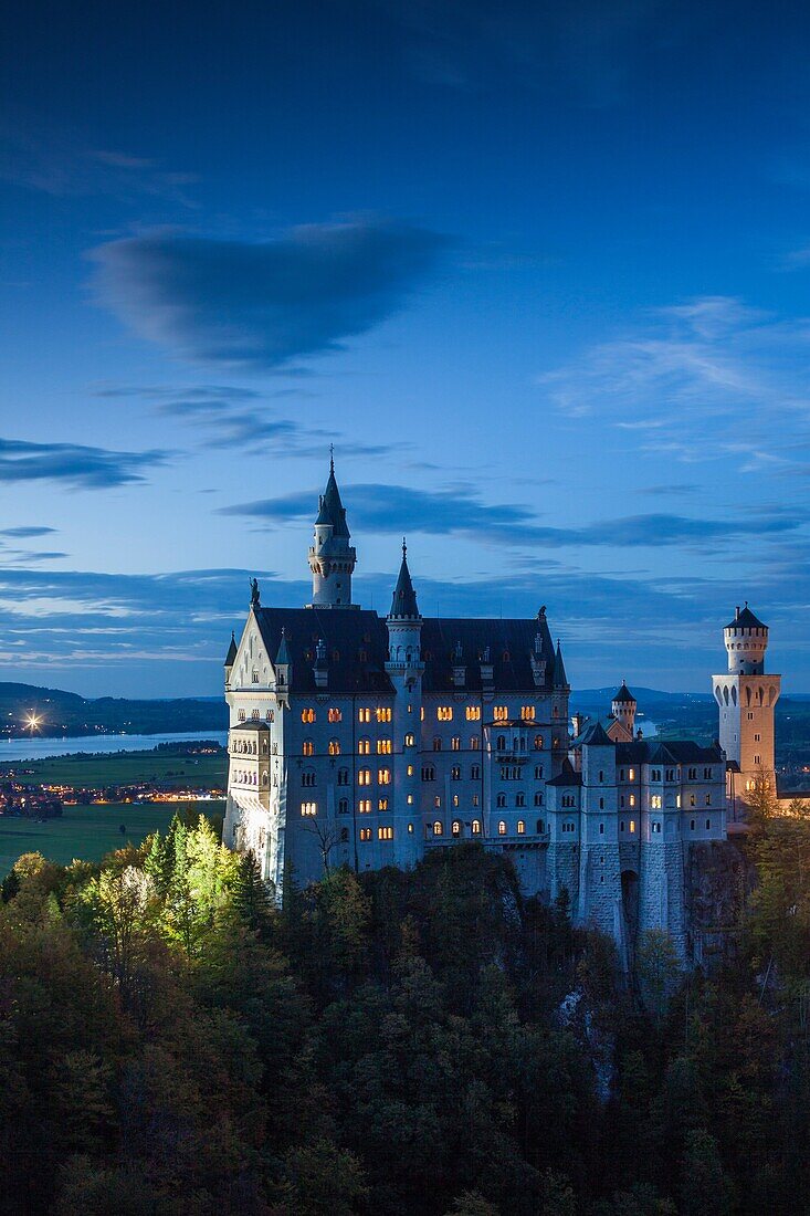 Germany, Bavaria, Hohenschwangau, Schloss Neuschwanstein castle, Marienbrucke bridge view, dusk.