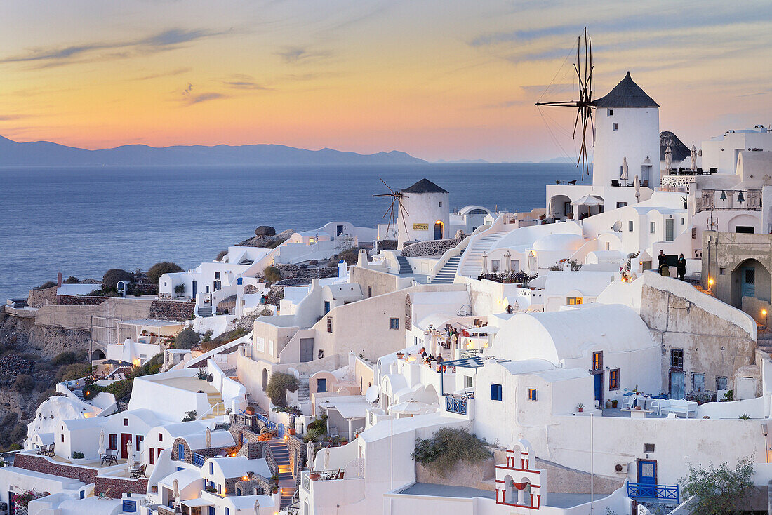 View of Oia with traditional greek windmill of Santorini, Oia Village, Santorini, Aegean Island, Cyclades Islands, Greek Islands, Greece, Europe.