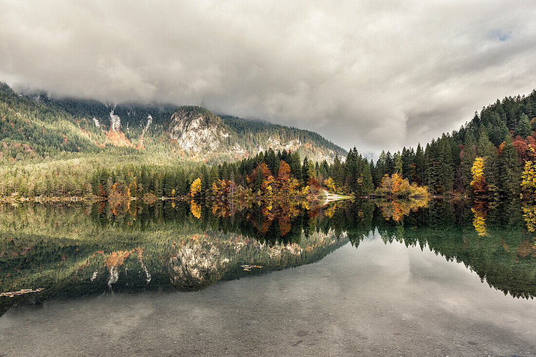 Italy, Trentino Alto Adige, Non valley, autumn reflections at Tovel Lake