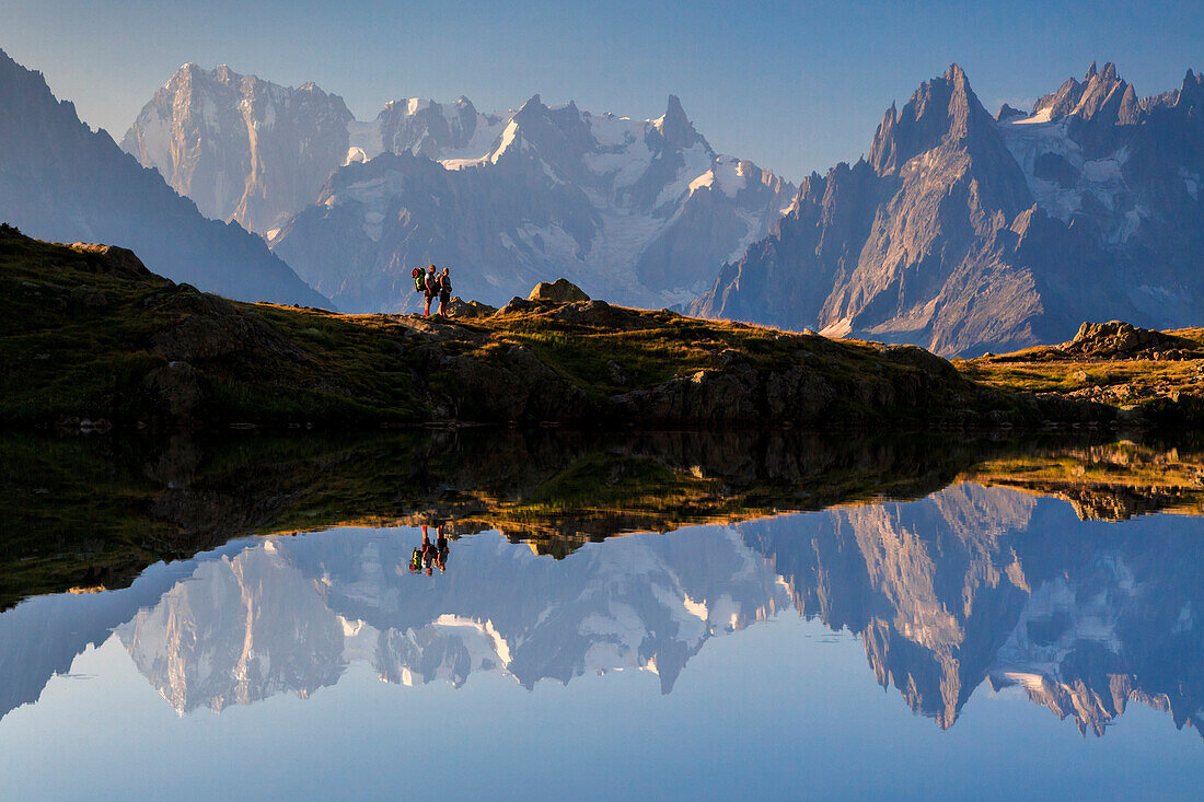 Two hikers on the Cheserys's lake, chamonix, france, europe