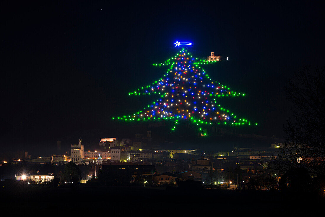 The biggest Christmas tree of the world, drawn with lights on the mount Ingino, Gubbio, Umbria, Italy