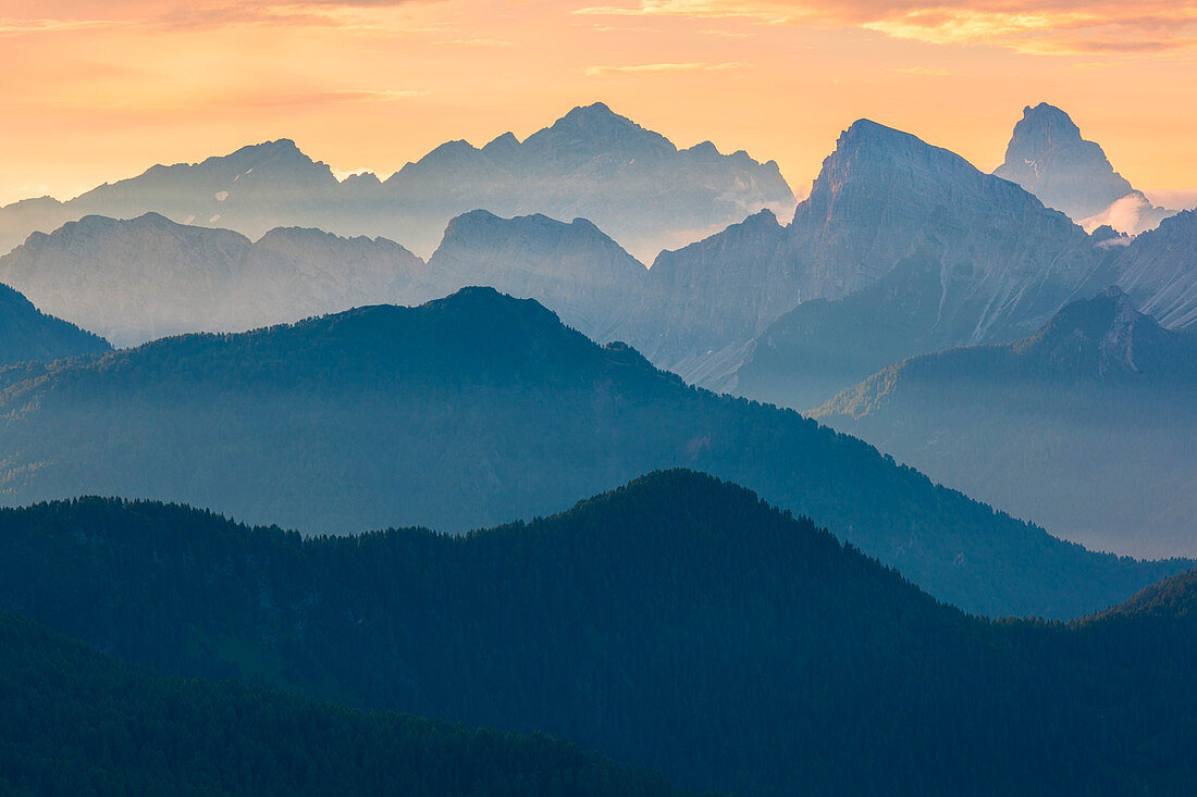 From right to left, the silohuette of the Duranno and his shoulder, before the Sassolungo of Cibiana, followed by the background Cima of the Cantoni, Cima dei Preti, Punta Patera, the Trident and Cima Laste. A glance in a summer sunrise from the Dolomites
