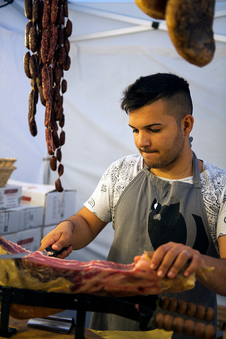 Prosciutto and sausages are part of the offerings at the weekly market in Sulmona