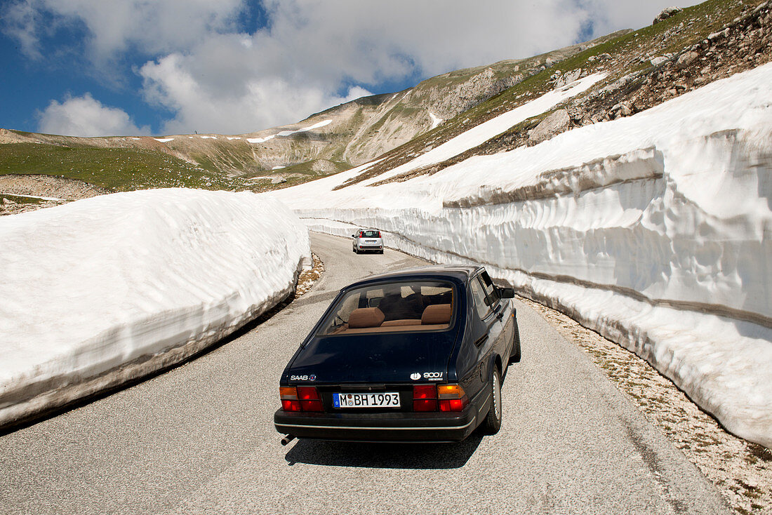 Even in summer snow frames the road on the Campo Imperatore