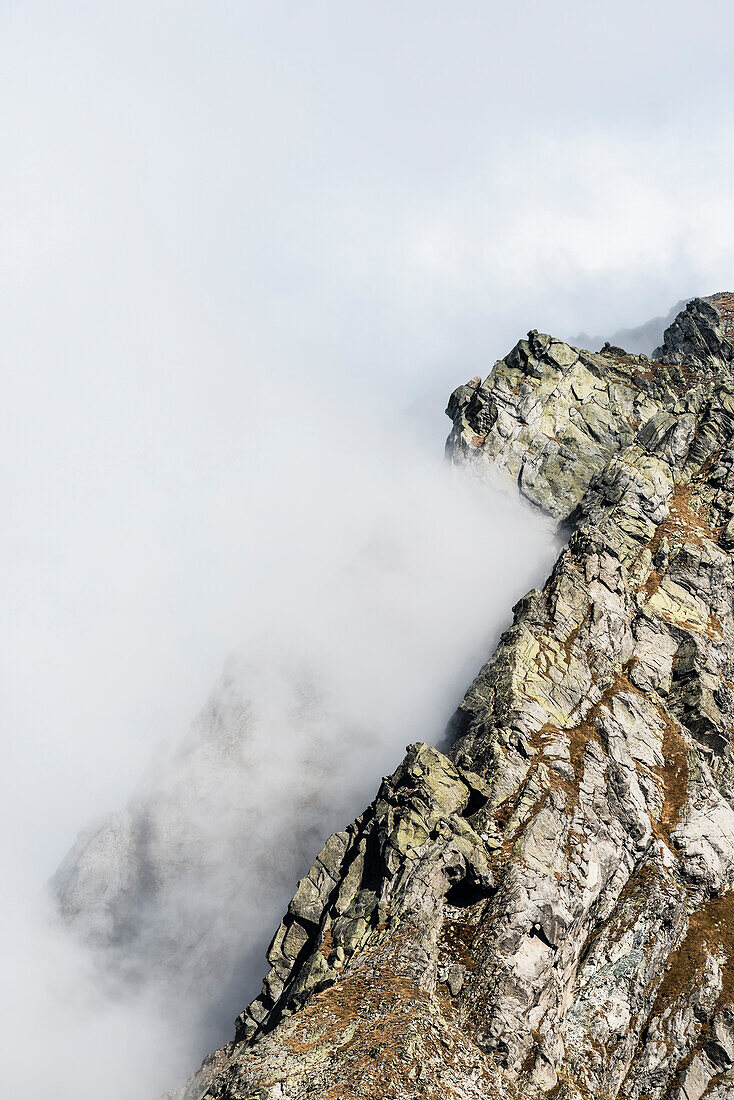 Steep mountains in the Sarntaler Alps with upcoming fog, Merano, South Tirol, Alto Adige, Italy