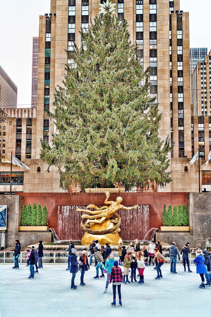 People Ice Skating at the Rockefeller Center, New York City, Rink, Near the Christmas Tree in the Background.