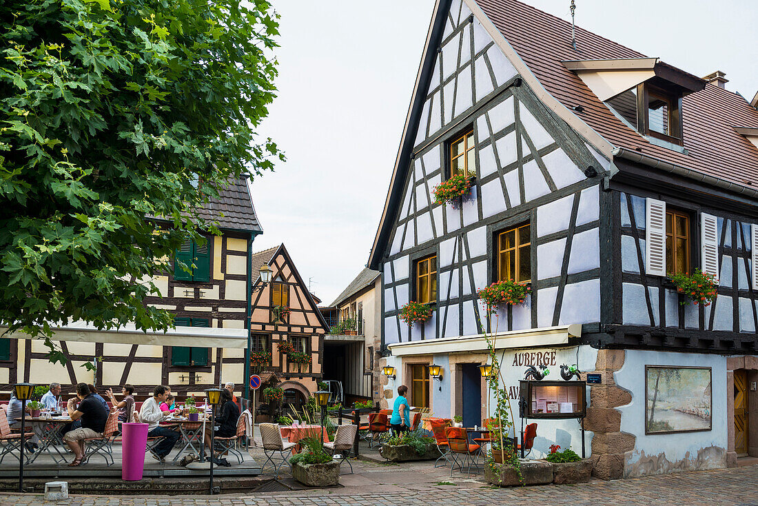 restaurant and colourful half-timbered houses, Bergheim, Alsace, France