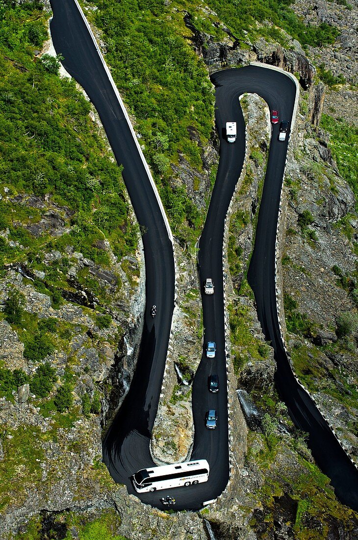 Coach in a narrow hairpin bend of the Trollstigen mountain road near Andalsnes, Rauma Municipality, Møre og Romsdal county, Norway.