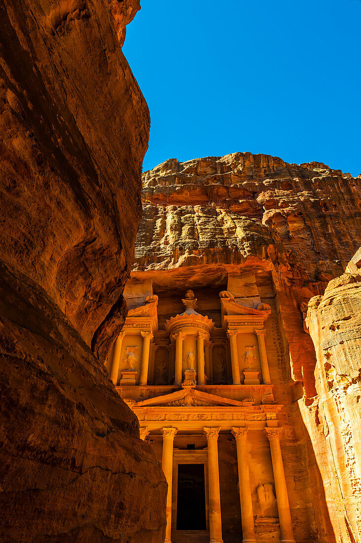 Looking from The Siq (gorge) to The Treasury (Al-Khazneh), Petra Archaeological Park (a UNESCO World Heritage Site), Petra, Jordan.