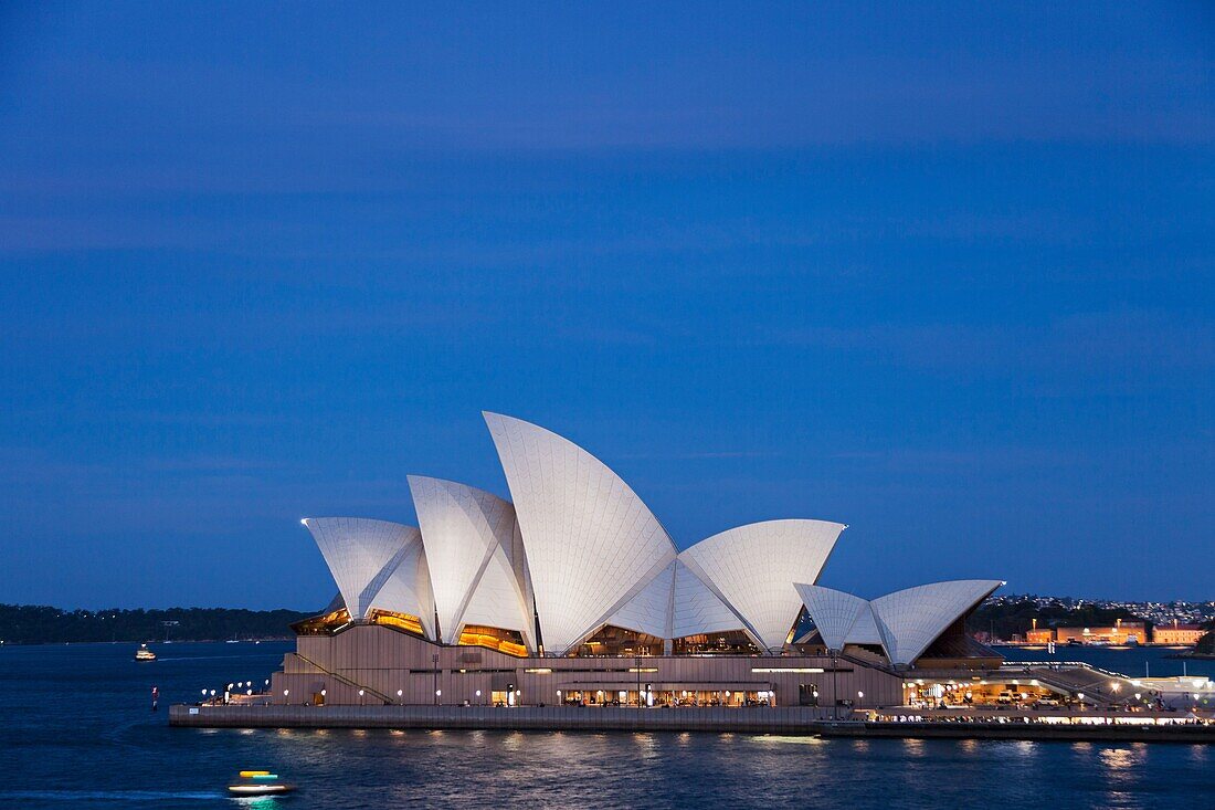 The sails of the Sydney Opera House, Designed by the Architect Jorn Utzorn at twilight,Bennelong Point, viewed from the Rocks, Sydney, New South Wales, Australia.