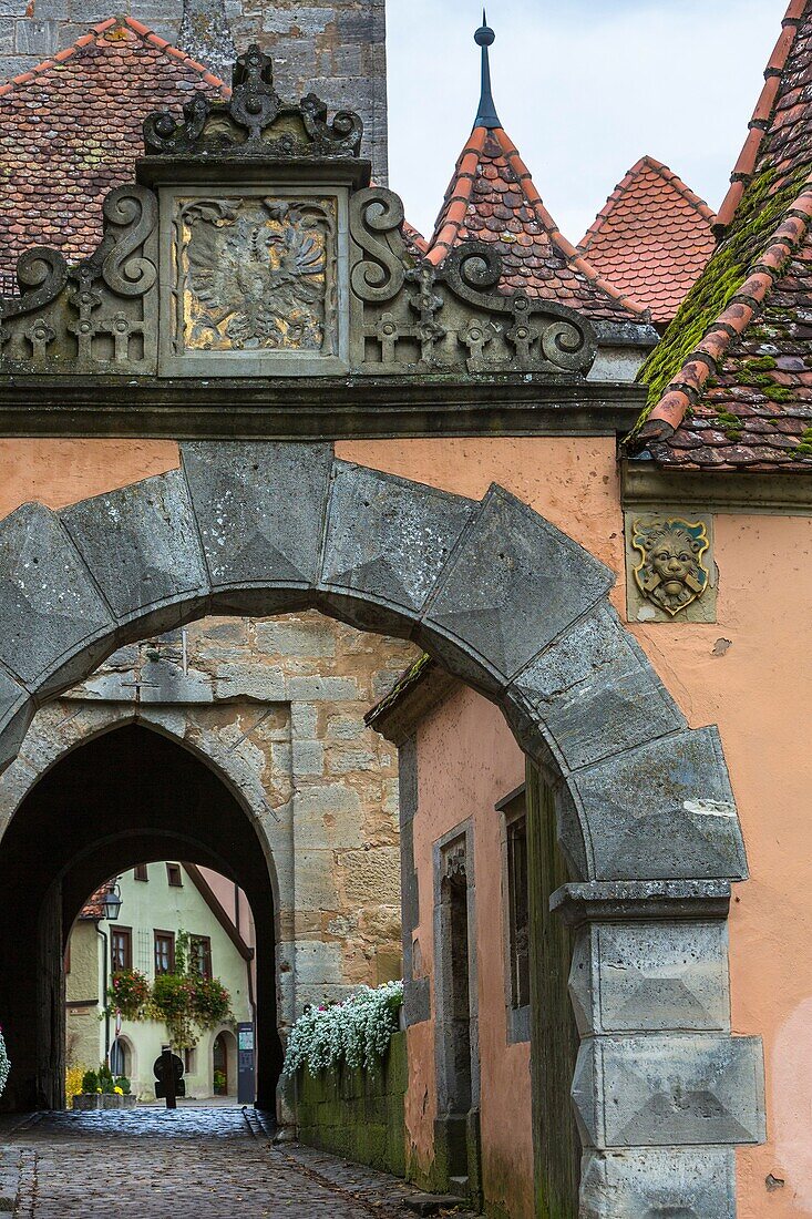View through the Burgtor (Castle Gate) with timbered houses in the background, Rothenburg ob der Tauber, Bavaria, Germany, Europe