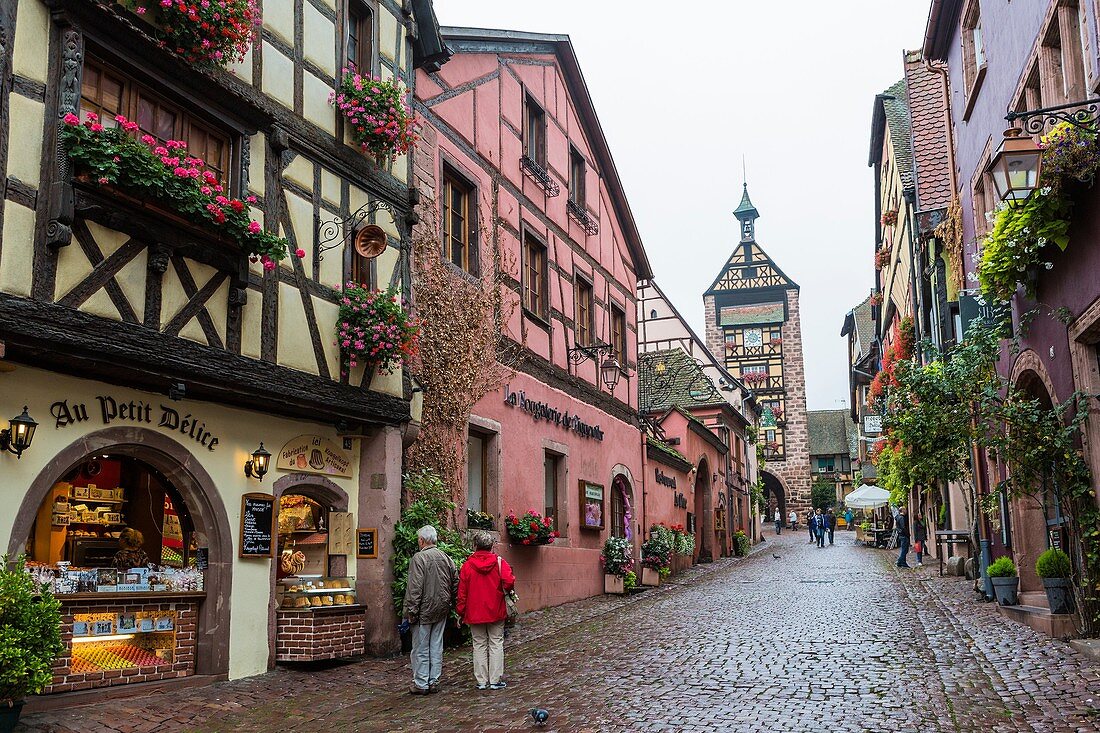 The picturesque village of Riquewihr with 13th century gate tower Dolder Tower in the background, Alsace, France, Europe