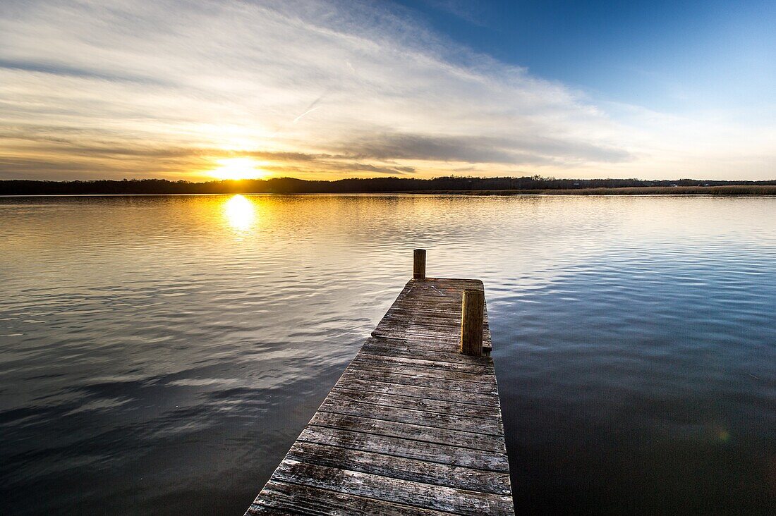 A dock on the Patuxent River at sunset in Calvert County, Maryland.