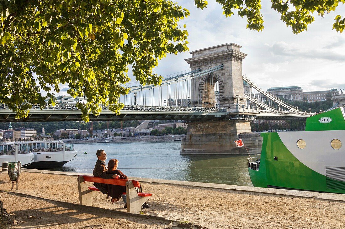 People at the Danube promenade by the Chain Bridge. Budapest, Hungary.