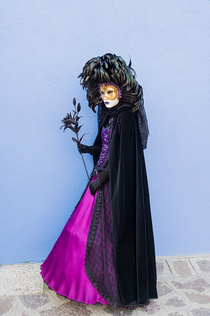 A masked woman at the carnival in Venice, Italy, Europe