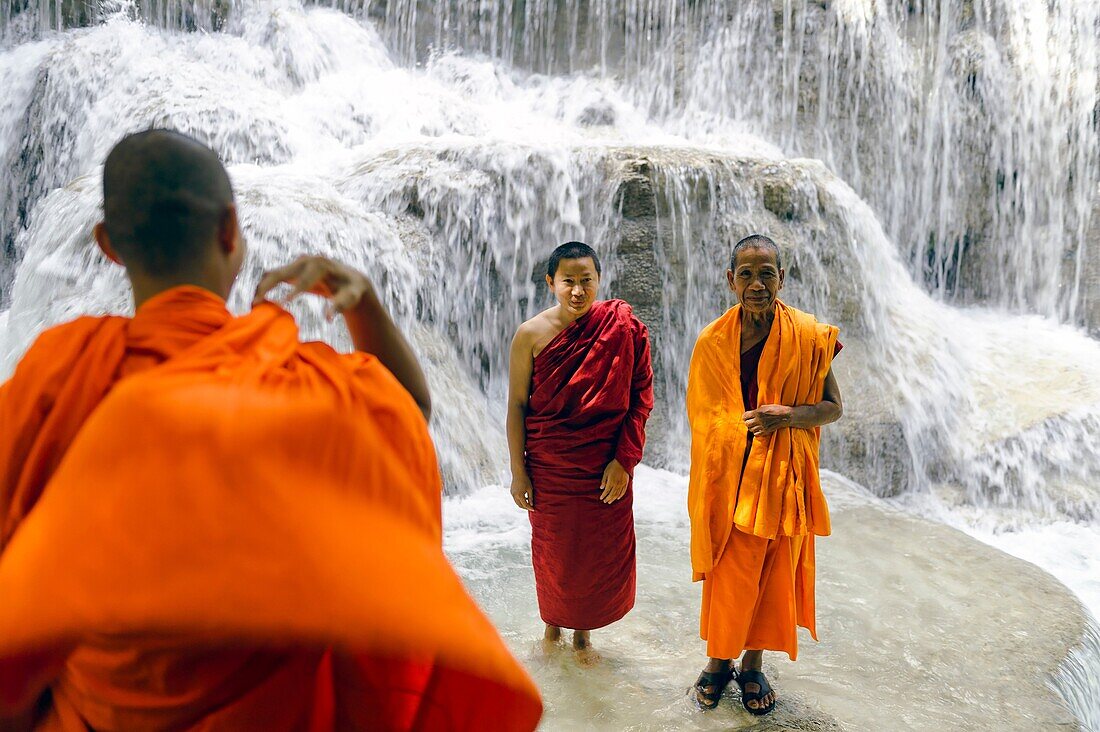 Asia. South-East Asia. Laos. Province of Luang Prabang. Monks at Kuang Si Waterfall.