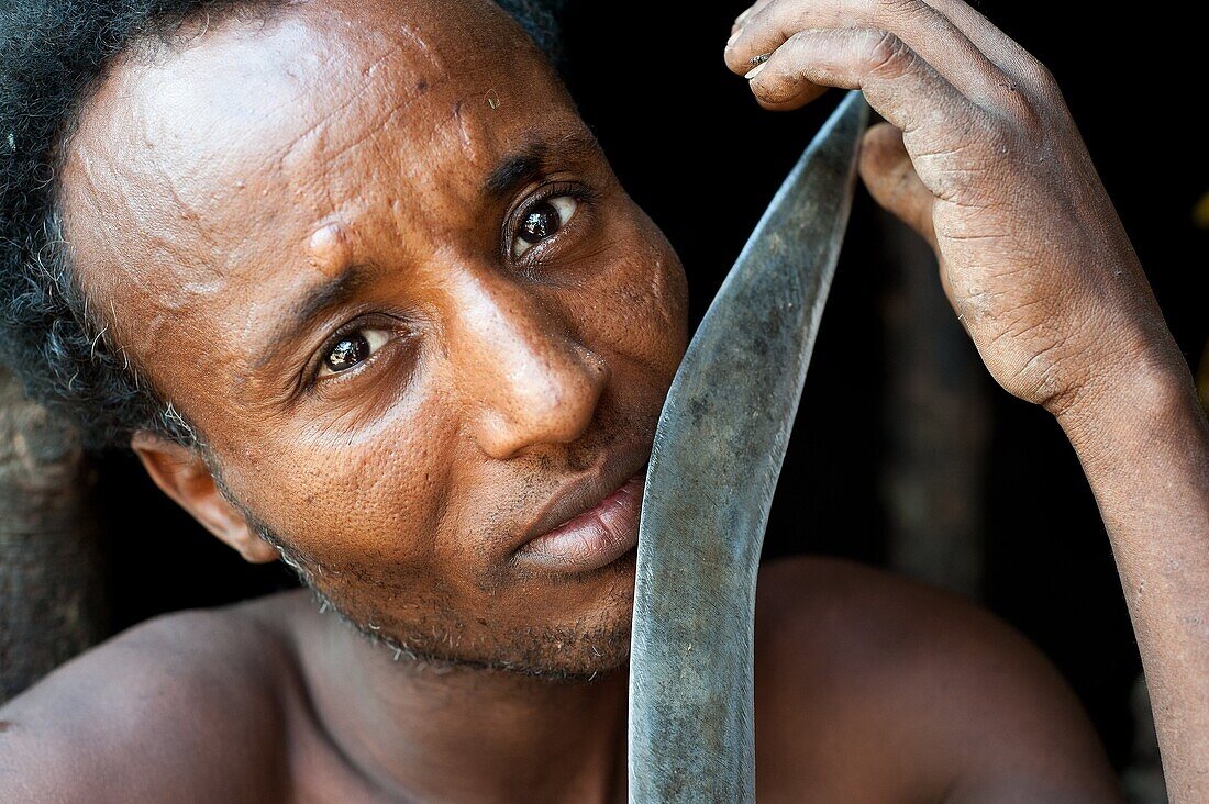 Man belonging to the Kereyu tribe holding his knife ( Ethiopia).