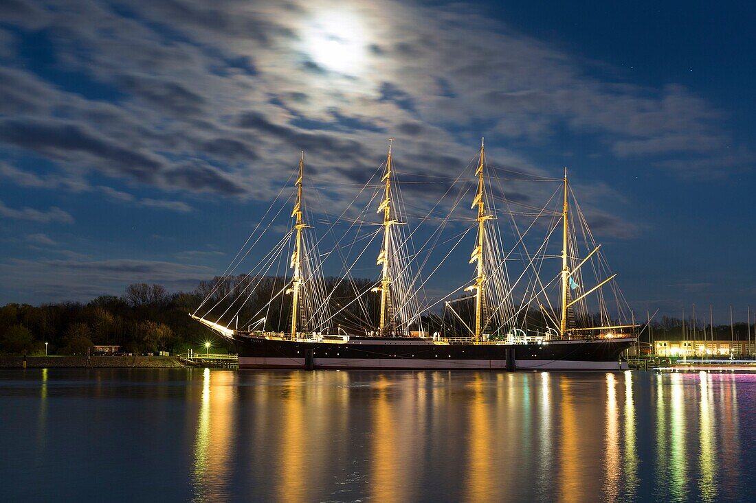sailing ship Passat with moon at night, Travemünde, Schleswig-Holstein, Germany.