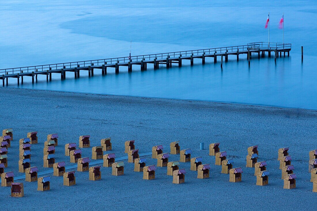 beach at the Baltic Sea with beach chairs at dusk, Travemünde, Schleswig-Holstein, Germany.