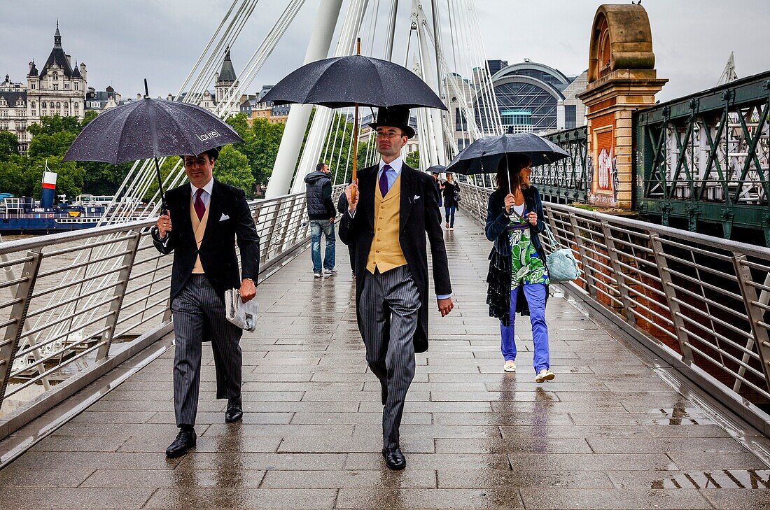 Two Men Wearing Traditional Top Hat and Tails On Their Way To Ascot For A Day At The Races, Golden Jubilee Bridges, London, England.