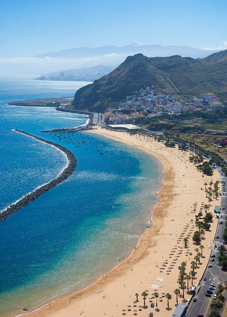 Las Teresitas beach, near Santa Cruz on Tenerife, Canary Islands, Spain. Mount Teide capped with snow in distance.