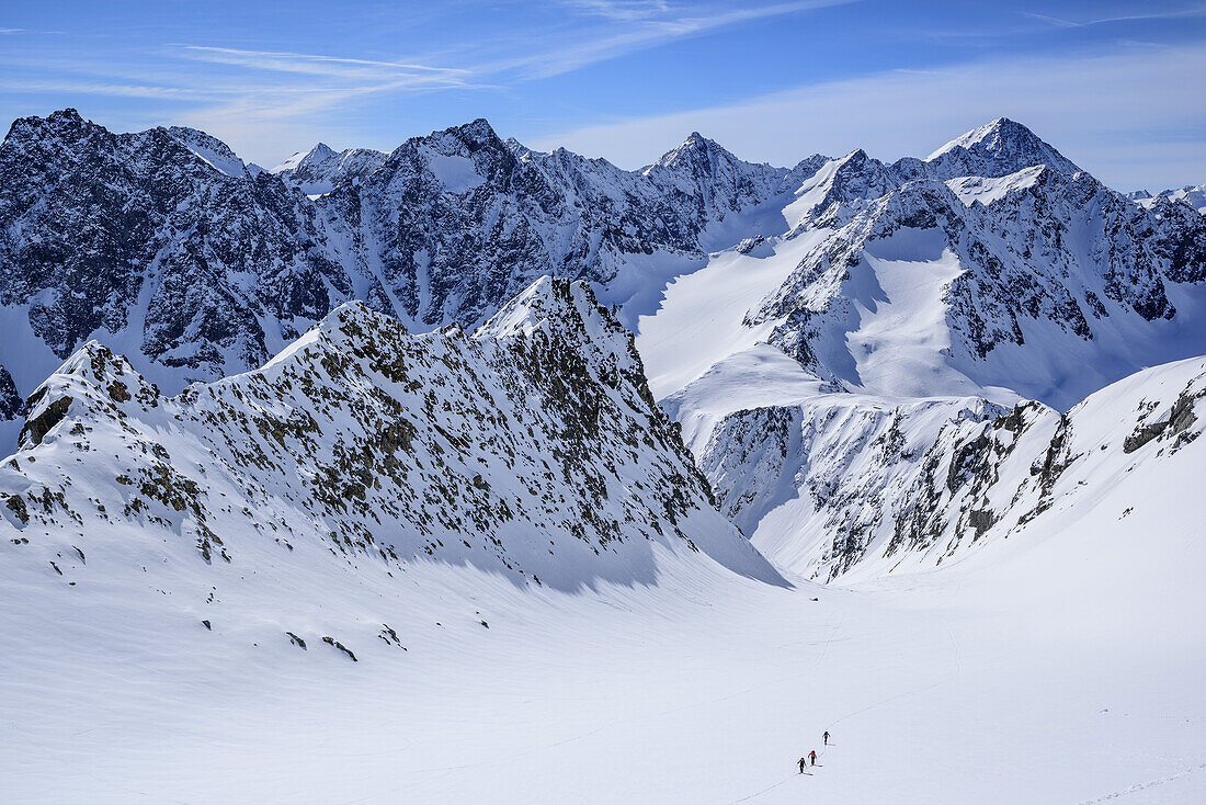 Three persons back-country skiing ascending to Hoher Seeblaskogel, Hinterer Brunnenkogel, Schrandele and Schrankogel in background, Hoher Seeblaskogel, Sellrain, Stubai Alps, Tyrol, Austria
