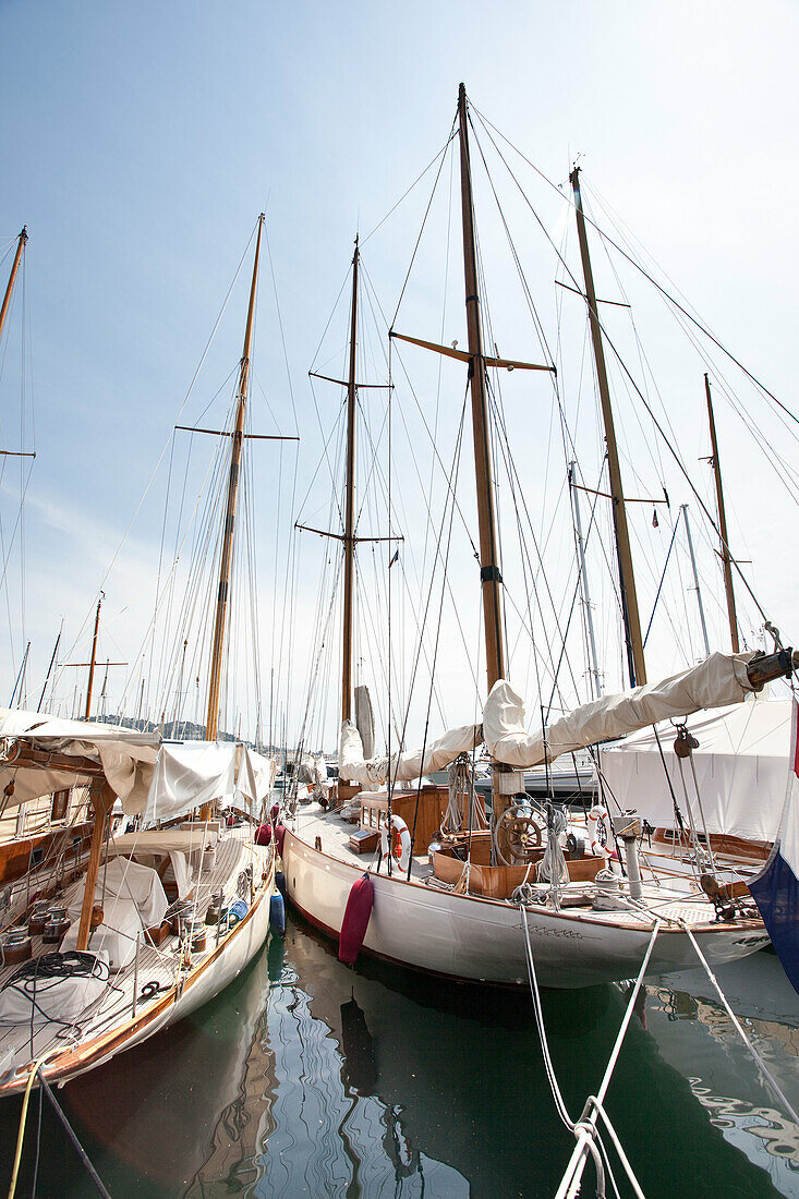 Private sailing yachts tied up at Cannes Harbour South of France.