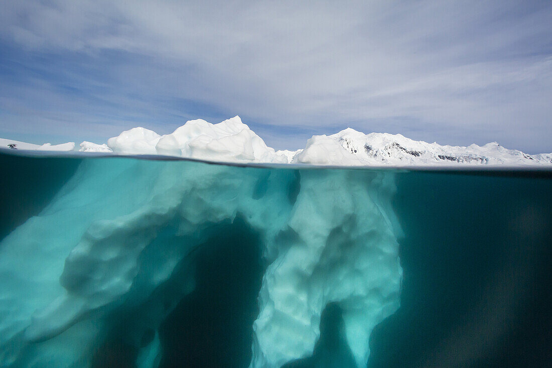 Above and below view of glacial ice near Wiencke Island, Neumayer Channel, Antarctica.