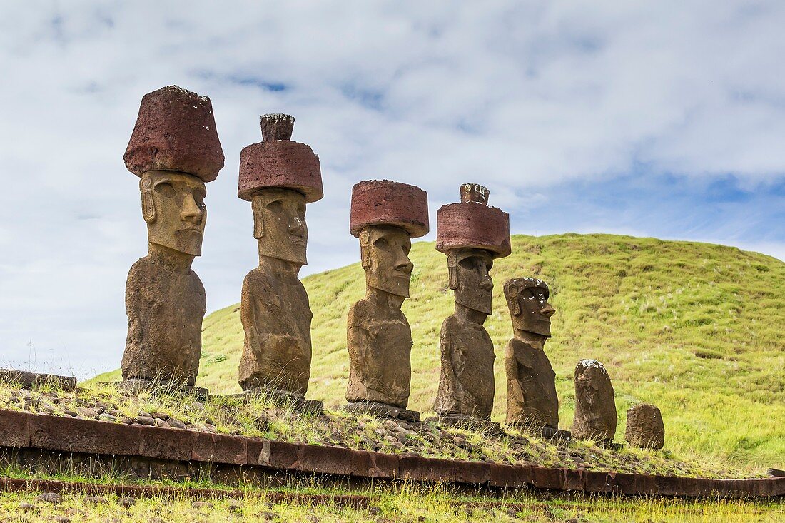 Moai with scoria red topknots at the restored ceremonial site of Ahu Nau Nau at Anakena on Easter Island, Isla de Pascua, Rapa Nui, Chile.