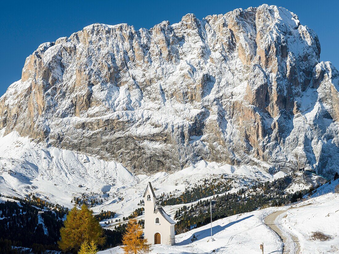 Mount Langkofel - Sassolungo and the chapel at Groedner Joch - Passo Gardena in the Dolomites of South Tyrol - Alto Adige. The Dolomites are listed as UNESCO World heritage. europe, central europe, italy, october.