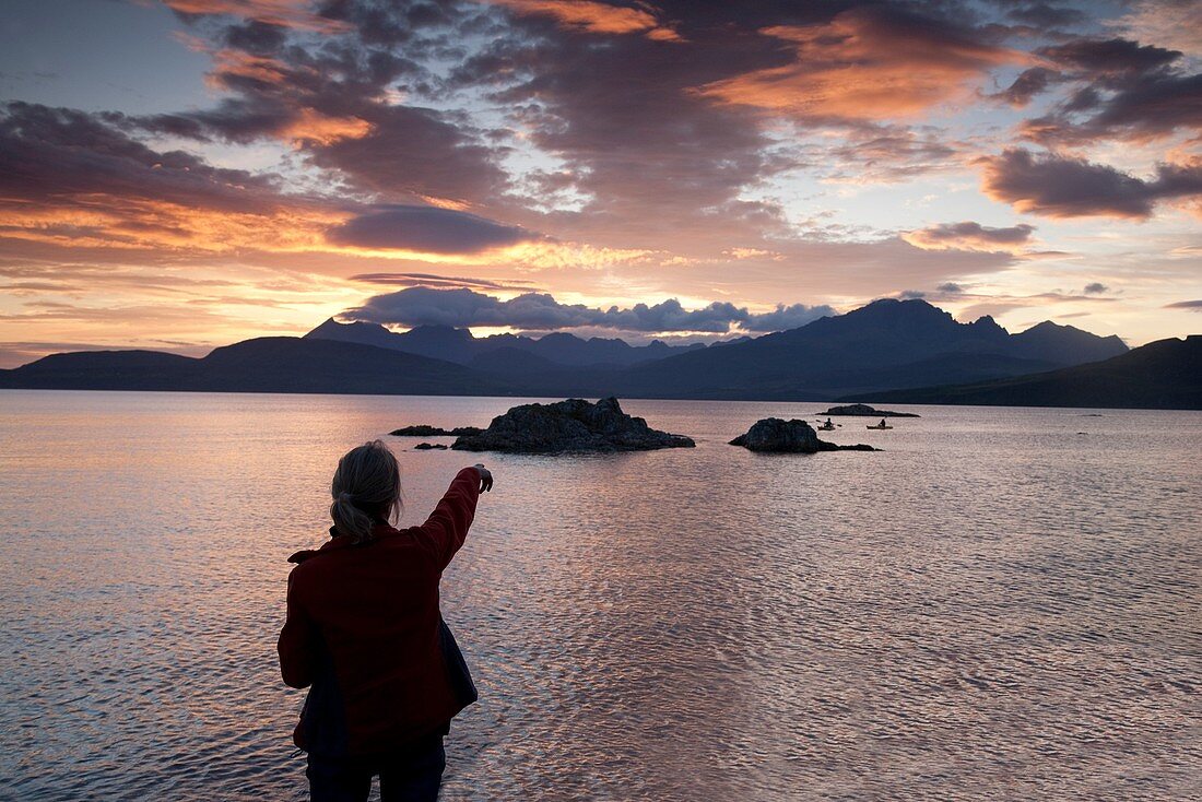 'Women Pointing to Cuillin Hills, Isle of Skye; Scotland.'