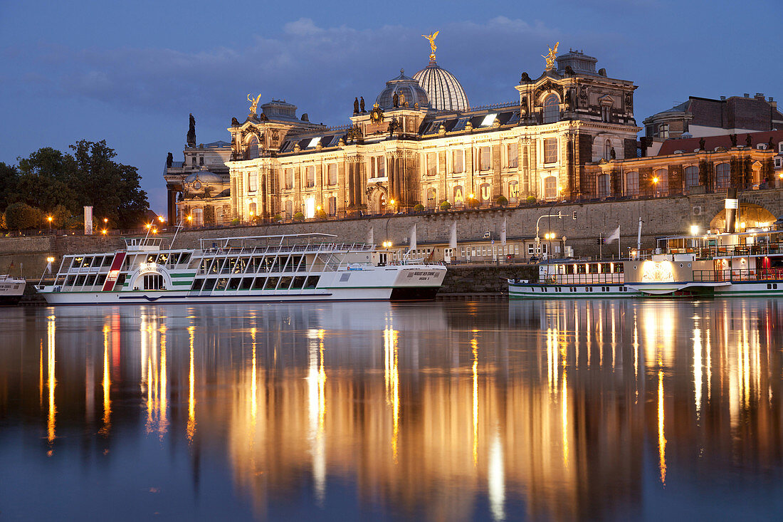 River Elbe with Brühl´s Terrace, Academy of Fine Arts and excursion ships in Dresden at night, Saxony, Germany, Europe.