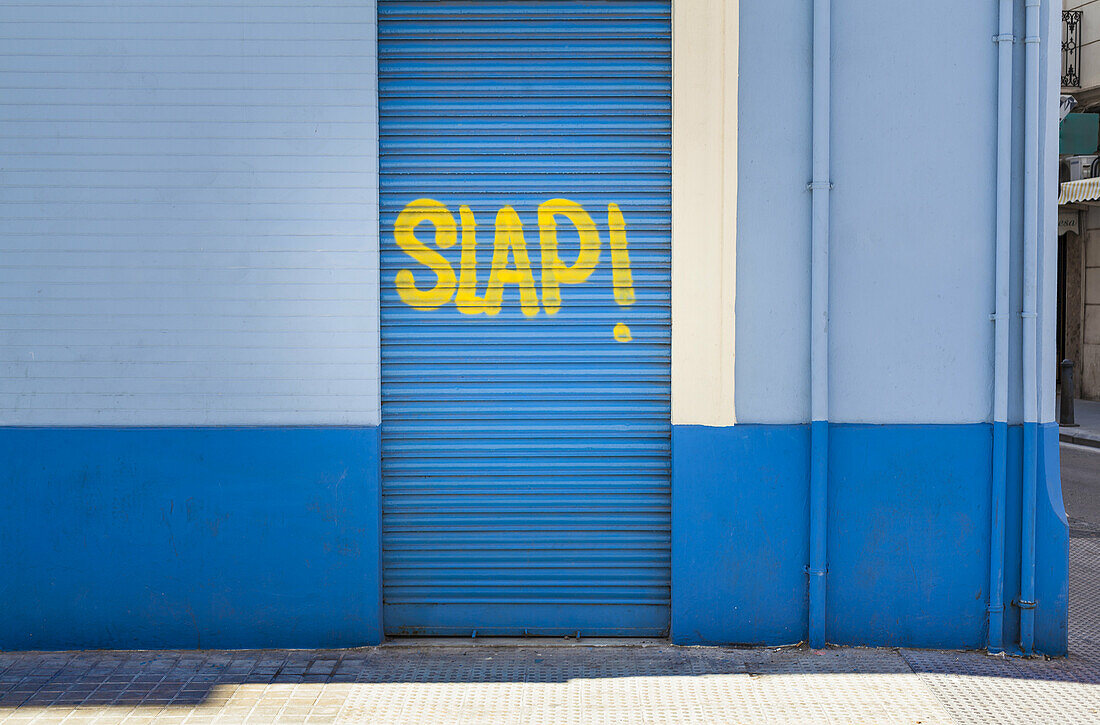 Graffiti on blue door