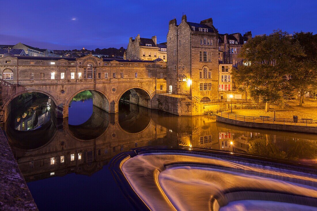 Before dawn at Pulteney Bridge and the weir on river Avon in Bath, Somerset, England.