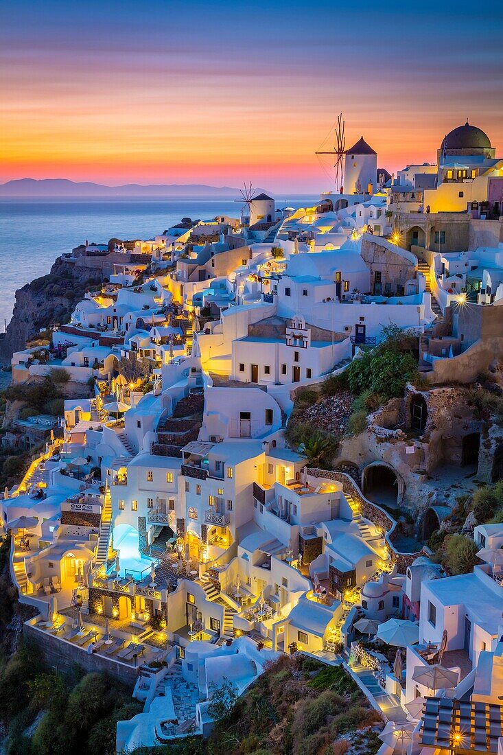 Iconic sunset in the town of Oia on the greek island Santorini (Thera). Santorini, classically Thera and officially Thira, is an island in the southern Aegean Sea, about 200 km (120 mi) southeast of Greece´s mainland. It is the largest island of a small, 