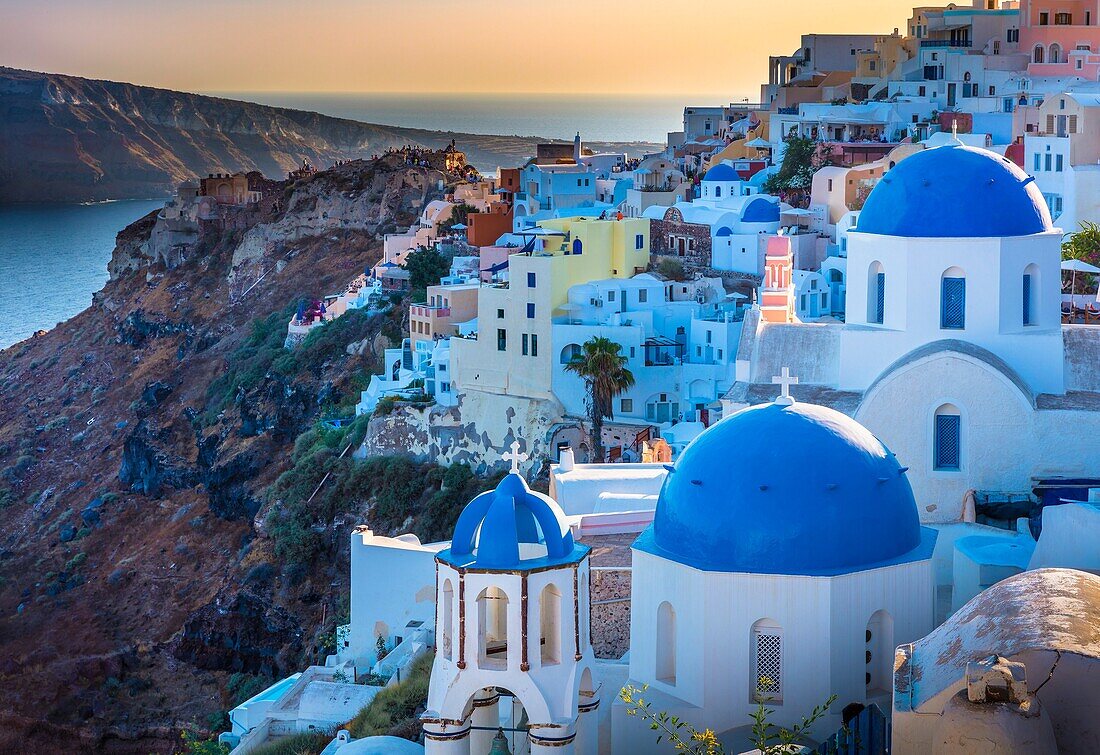 Iconic sunset in the town of Oia on the greek island Santorini (Thera). Santorini, classically Thera and officially Thira, is an island in the southern Aegean Sea, about 200 km (120 mi) southeast of Greece´s mainland. It is the largest island of a small, 