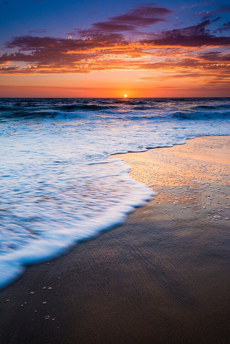 Sunset over the Pacific Ocean from Ventura State Beach, Ventura, California USA.