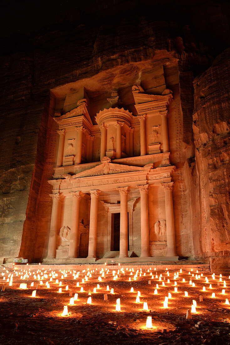 'The famous and elaborately carved façade of Al Khazneh (the Treasury), carved out of a sandstone rock face, lighted with candles during ''Petra by night''. Jordan (Hashemite Kingdom of), Ma´an Governorate (Maan), ancient city of Petra.'