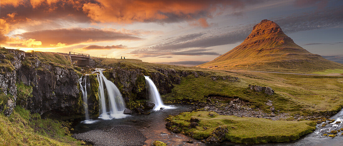 Panorama of Kirkjufell mountain and waterfall at sunset Snaefelness Peninsula prime tourist destination Iceland