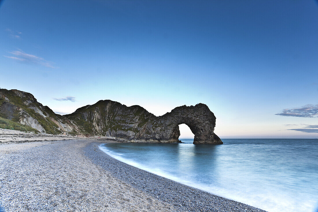 Looking towards Durdle Door from the beach. The evening light producing soft colours at the end of the day.