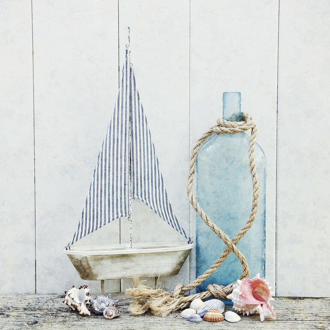 Sailing ship with bottle rope and sea shells.