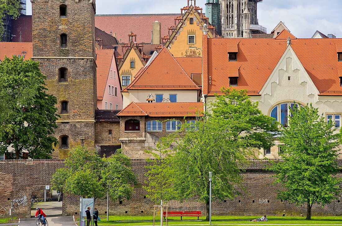 Ulm, Germany - view of the historic waterfront at the river Danube showing the city walls, conservatoire, Leaning Tower, townhall and cathedral.