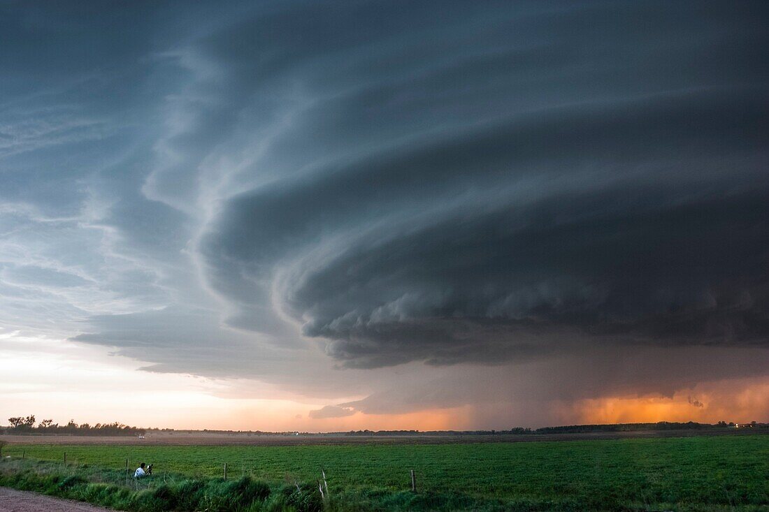 Striated supercell passes just north of Grand Island Nebraska May 10, 2005 producing large hail and lightning during twilight.